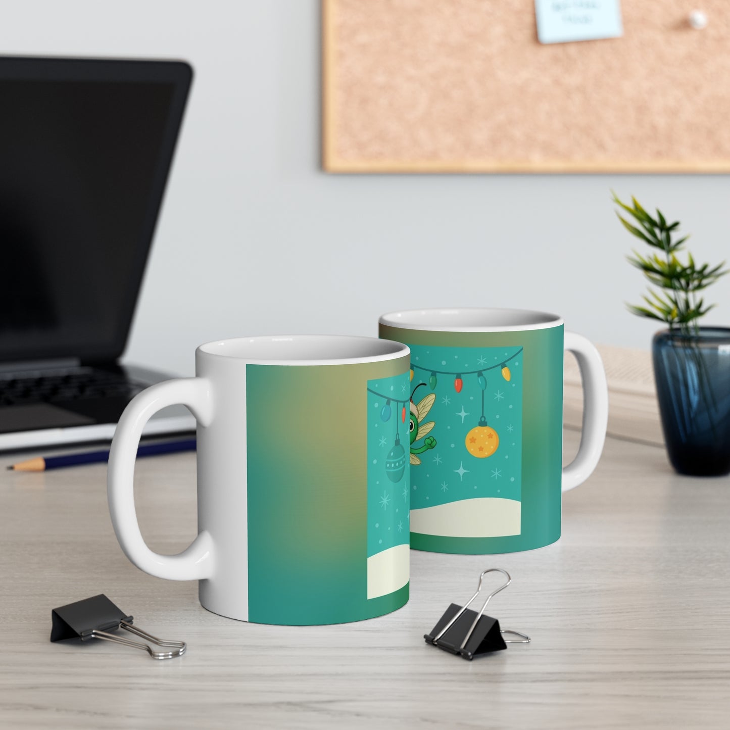 Two mugs with festive designs on a desk with office supplies and a plant. Echo