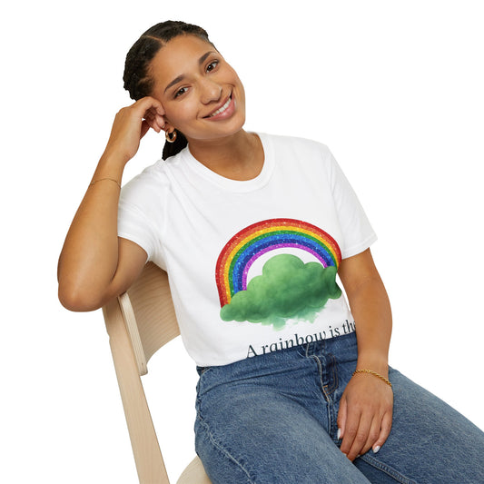 Unisex white t-shirt from the Rainbow Cloud Series featuring a colorful rainbow over a storm cloud design that represents hope and resilience. Character: Hope person wearing front