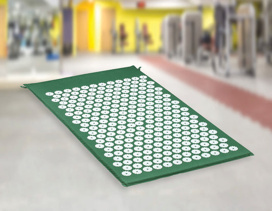 Acupressure mat with white dots on a blurred indoor background